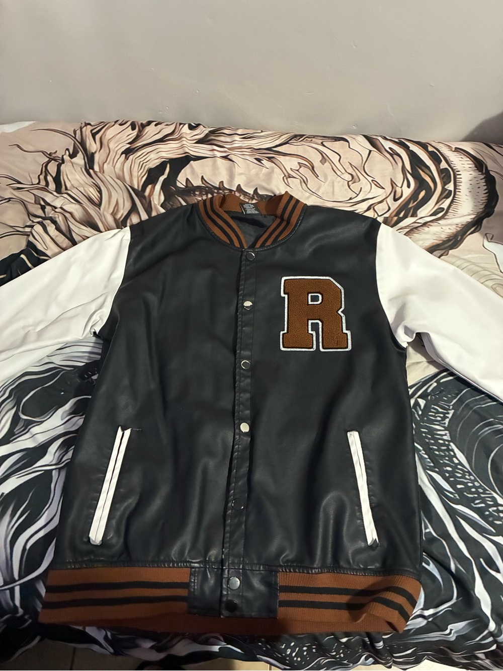 Amazon Black Leather-Style Varsity Jacket with White Sleeves and Brown Trim